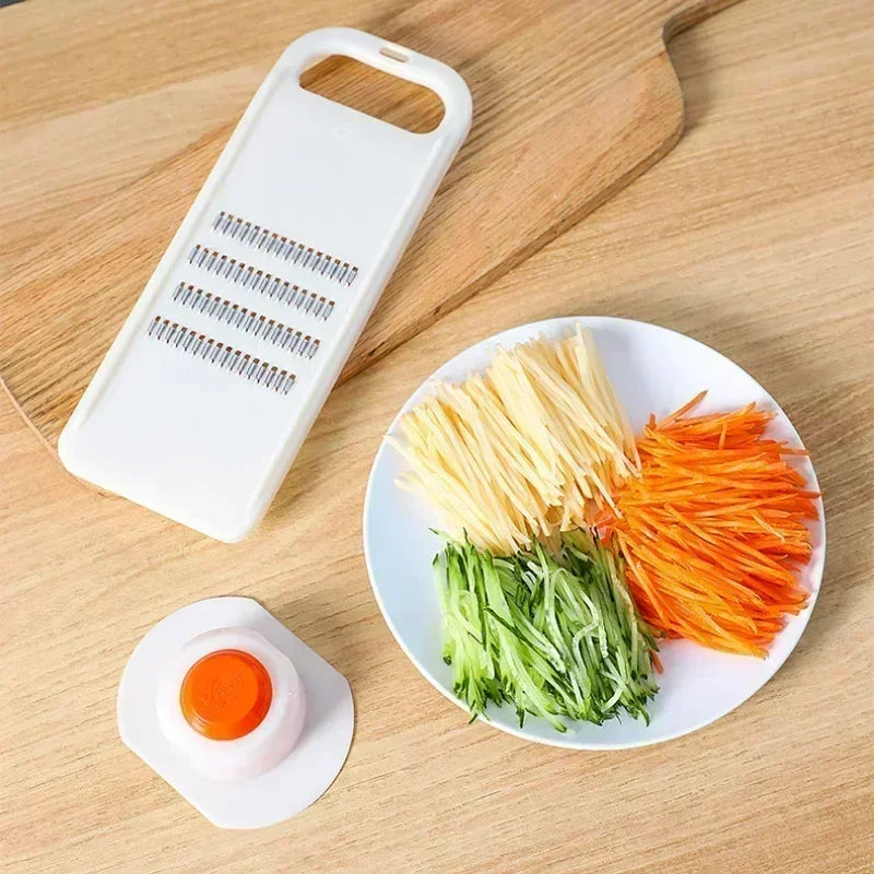 Hand-Held Vegetable Grater and Slicer with Container